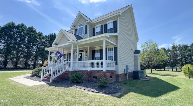 view of front of house with covered porch, crawl space, roof with shingles, cooling unit, and a front lawn