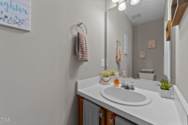 228 Honeywell Way, Fuquay Varina, NC 27526 - bathroom featuring visible vents, toilet, and vanity