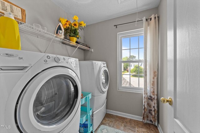 228 Honeywell Way, Fuquay Varina, NC 27526 - washroom with washer and dryer, laundry area, a wealth of natural light, and baseboards