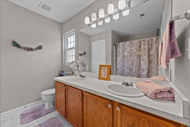228 Honeywell Way, Fuquay Varina, NC 27526 - full bathroom featuring a sink, toilet, and visible vents