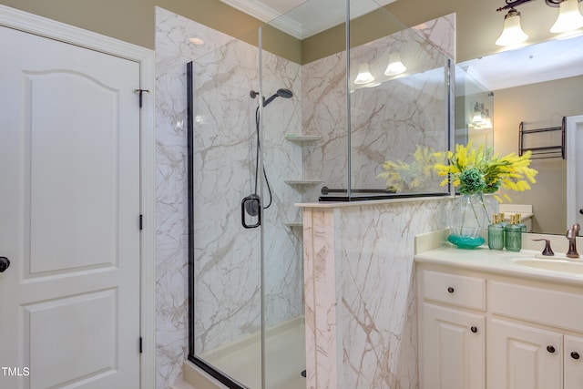 bathroom with crown molding, a marble finish shower, vanity, and tile walls
