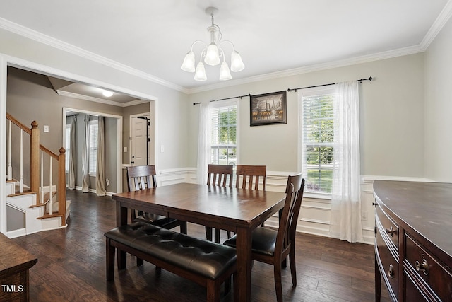 dining space with stairway, a chandelier, crown molding, dark wood-style floors, and wainscoting