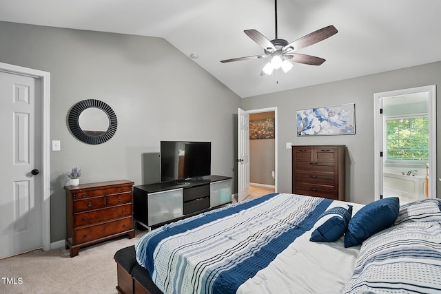 bedroom featuring lofted ceiling, light carpet, baseboards, ceiling fan, and connected bathroom