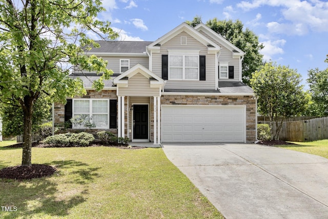 430 Dogwood Creek Pl, Fuquay Varina, NC 27526 - view of front facade with stone siding, a garage, and driveway