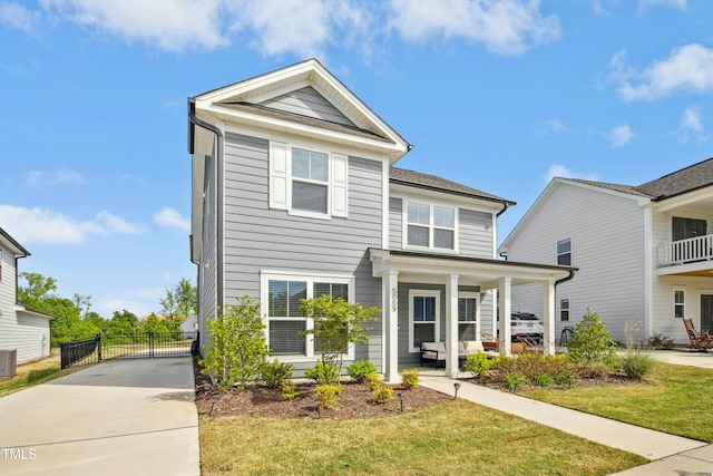 5009 Megara Run, Raleigh, NC 27603 - view of front of property with covered porch, central air condition unit, concrete driveway, and a gate