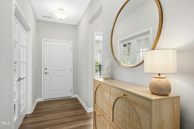 5009 Megara Run, Raleigh, NC 27603 - entryway featuring dark wood finished floors and baseboards