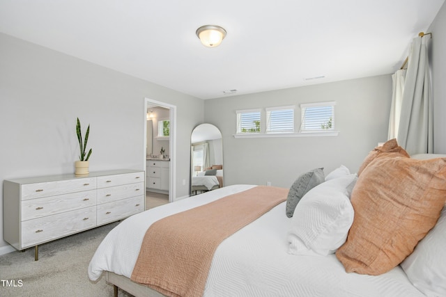 5009 Megara Run, Raleigh, NC 27603 - bedroom with arched walkways, light colored carpet, and connected bathroom