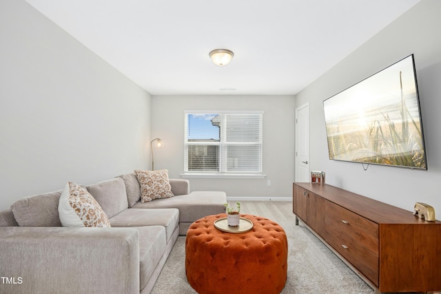 5009 Megara Run, Raleigh, NC 27603 - living area featuring light carpet and baseboards