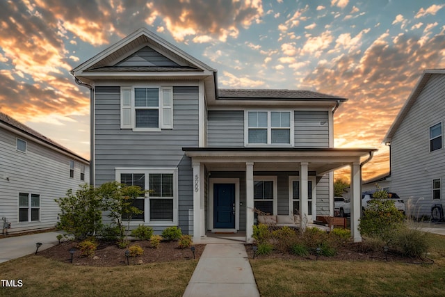 5009 Megara Run, Raleigh, NC 27603 - townhome / multi-family property featuring covered porch and a lawn