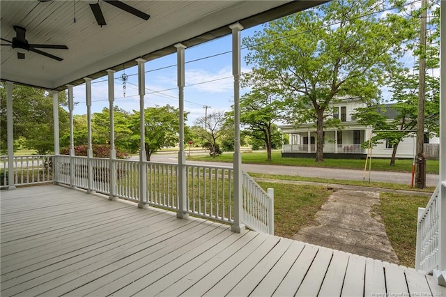 unfurnished sunroom featuring plenty of natural light and a ceiling fan