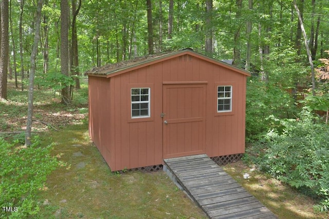 view of shed featuring a wooded view