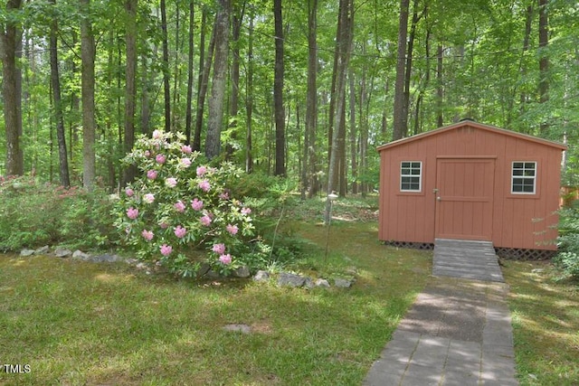 view of shed featuring a forest view