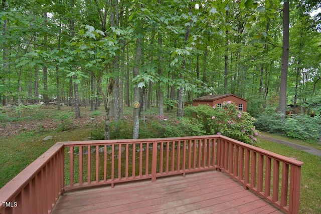 wooden deck featuring an outbuilding