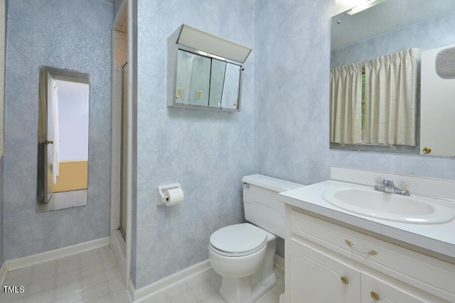 full bathroom with vanity, baseboards, an enclosed shower, and toilet