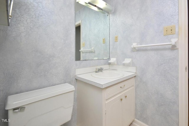 half bath with vanity and toilet