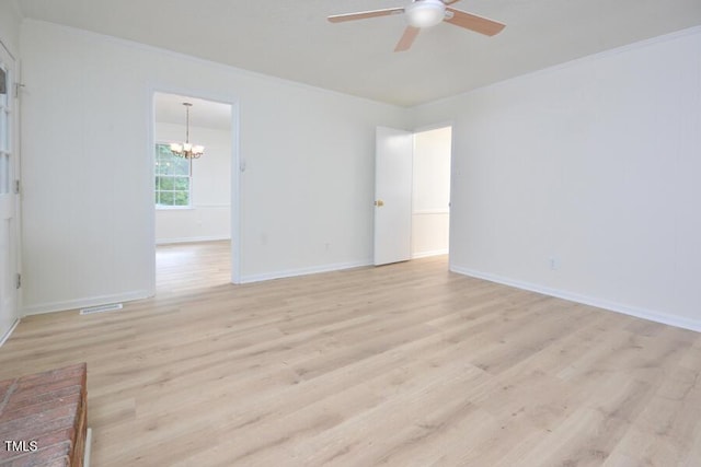 5825 Scalybark Rd, Durham, NC 27712 - empty room featuring a ceiling fan, a chandelier, light wood-style floors, and ornamental molding