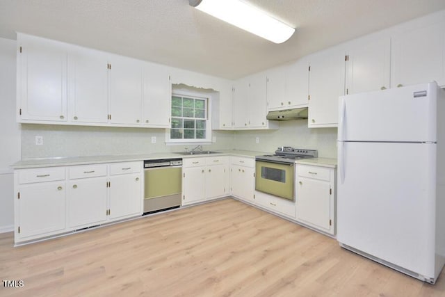 5825 Scalybark Rd, Durham, NC 27712 - kitchen featuring white appliances, under cabinet range hood, light wood-style flooring, light countertops, and white cabinetry