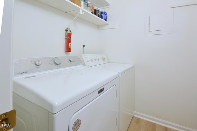 5825 Scalybark Rd, Durham, NC 27712 - laundry area featuring separate washer and dryer, light wood-style floors, and electric panel