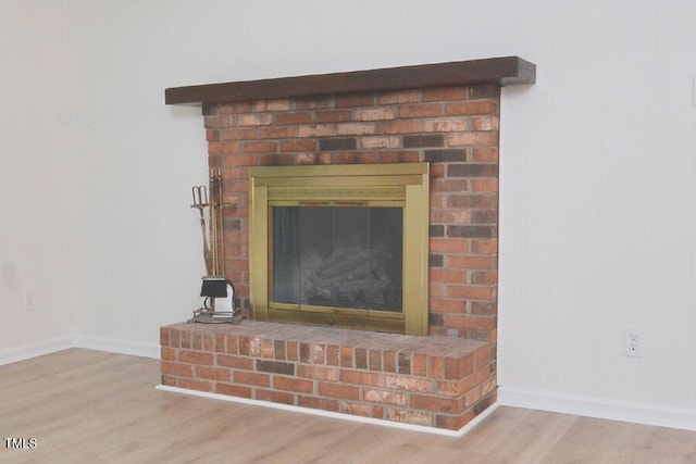 5825 Scalybark Rd, Durham, NC 27712 - detailed view of wood finished floors and a fireplace