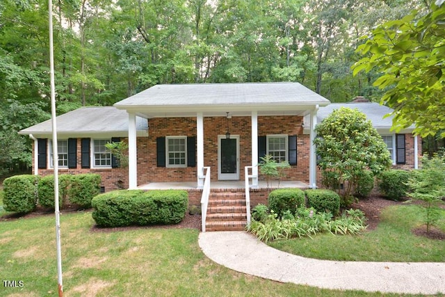 5825 Scalybark Rd, Durham, NC 27712 - view of front of house featuring brick siding, a porch, and a front lawn