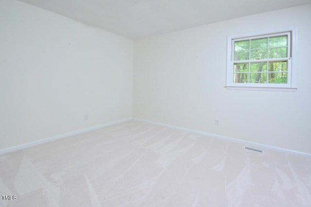5825 Scalybark Rd, Durham, NC 27712 - unfurnished room featuring light colored carpet and baseboards