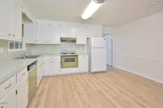 5825 Scalybark Rd, Durham, NC 27712 - kitchen featuring white appliances, under cabinet range hood, light wood finished floors, and white cabinetry