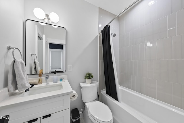 full bathroom featuring vanity, shower / bath combination with curtain, and toilet