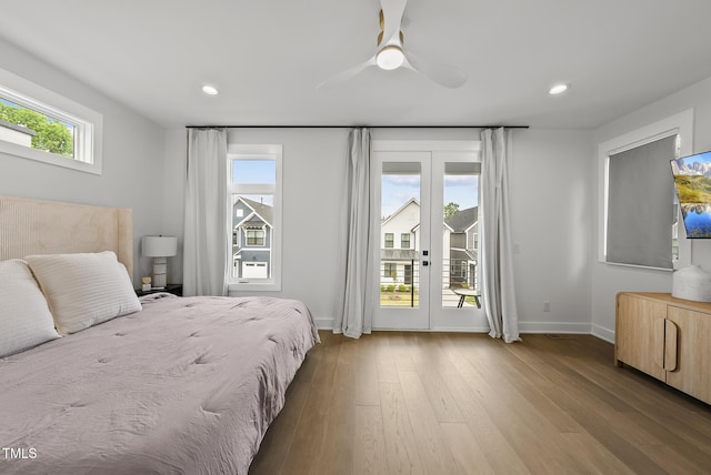 bedroom with baseboards, access to outside, recessed lighting, and wood finished floors
