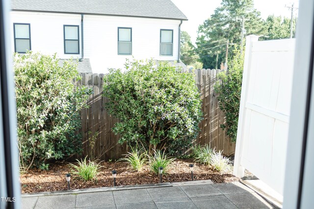 278 S Raleigh St, Angier, NC 27501 - view of home's exterior with fence and roof with shingles