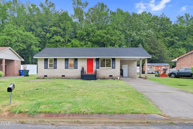 2116 Cedar Ln, Kinston, NC 28501 - single story home with a front lawn, brick siding, an attached carport, crawl space, and driveway