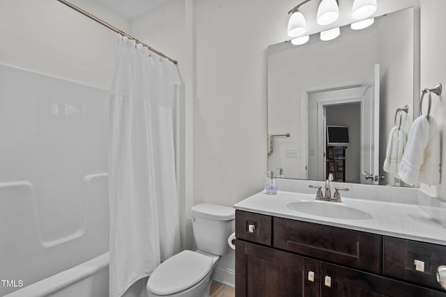 full bath featuring toilet, shower / tub combo with curtain, and vanity
