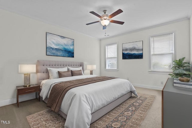 bedroom with light colored carpet, baseboards, and multiple windows