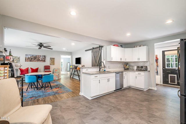 553 Isley Rd, Haw River, NC 27258 - kitchen with stainless steel appliances, a sink, white cabinets, light stone counters, and open floor plan