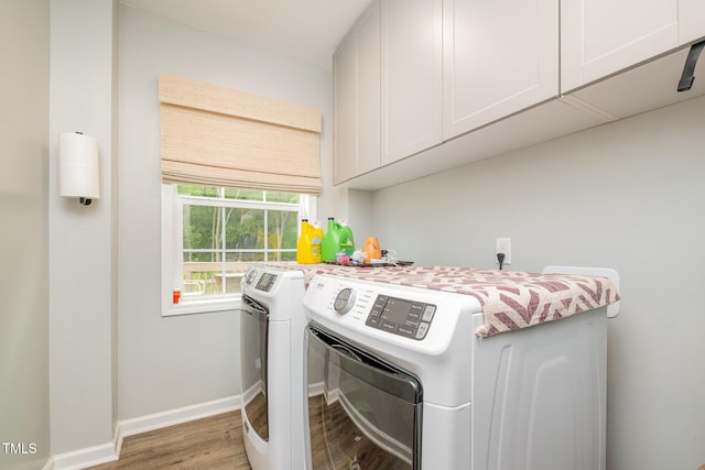 553 Isley Rd, Haw River, NC 27258 - washroom with cabinet space, washer and clothes dryer, wood finished floors, and baseboards
