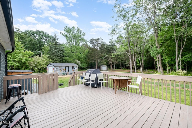 553 Isley Rd, Haw River, NC 27258 - wooden deck featuring a shed, an outdoor structure, outdoor dining area, and a yard