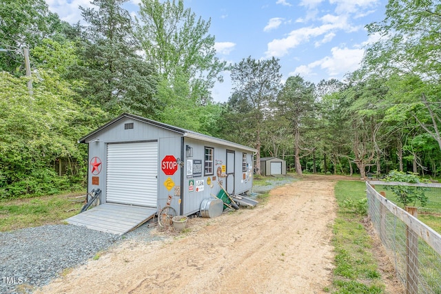 553 Isley Rd, Haw River, NC 27258 - view of front of home featuring an outdoor structure, a shed, and fence