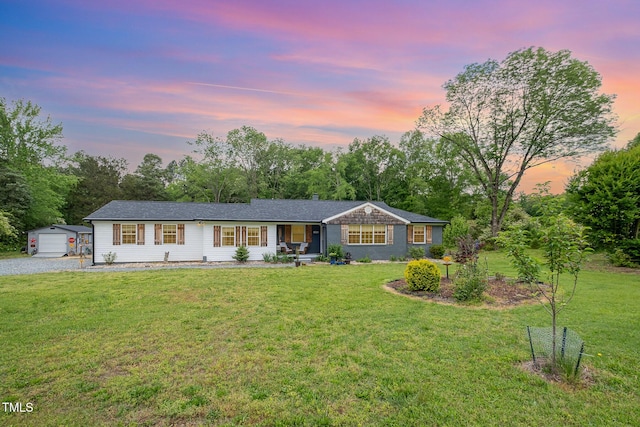 553 Isley Rd, Haw River, NC 27258 - ranch-style home featuring an outbuilding, a front yard, and view of wooded area