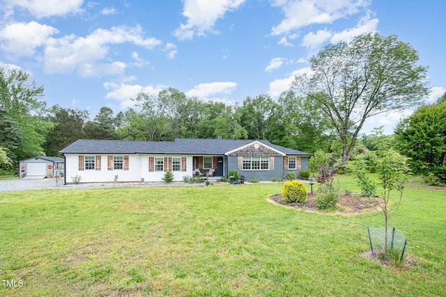 553 Isley Rd, Haw River, NC 27258 - single story home featuring an outbuilding, a front lawn, view of scattered trees, and driveway