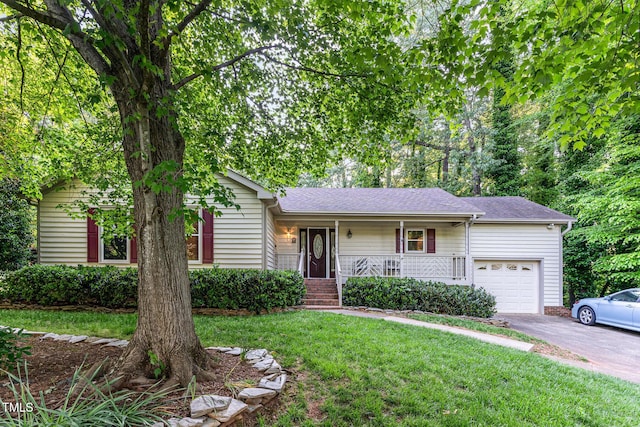 ranch-style house featuring covered porch, driveway, roof with shingles, a front lawn, and an attached garage