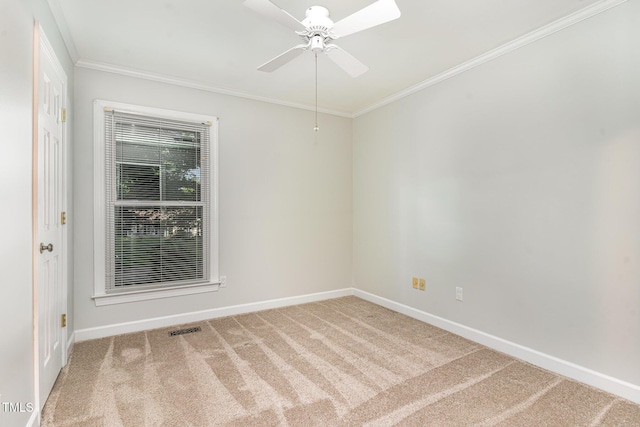 unfurnished room with crown molding, baseboards, ceiling fan, and carpet flooring