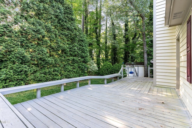 deck featuring a wooded view