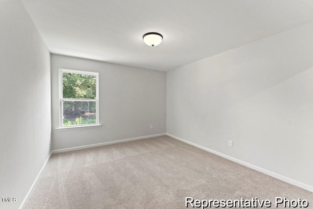 207 Curling Creek Dr Unit 300P, Clayton, NC 27527 - spare room featuring baseboards and carpet flooring