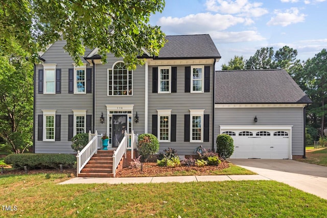 116 Dallavia Ct, Morrisville, NC 27560 - colonial inspired home featuring concrete driveway, a shingled roof, a front lawn, and a garage