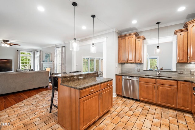 116 Dallavia Ct, Morrisville, NC 27560 - kitchen featuring a kitchen breakfast bar, crown molding, stainless steel dishwasher, a sink, and open floor plan
