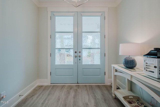 328 Boone St, Chapel Hill, NC 27516 - entryway with french doors, light wood-type flooring, and baseboards