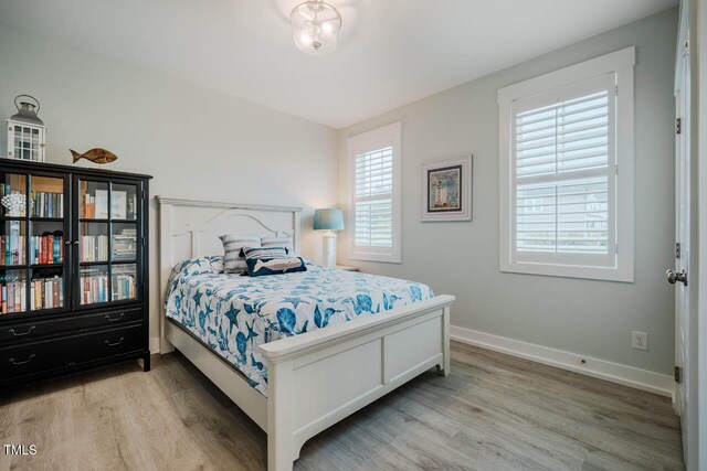 328 Boone St, Chapel Hill, NC 27516 - bedroom with wood finished floors and baseboards