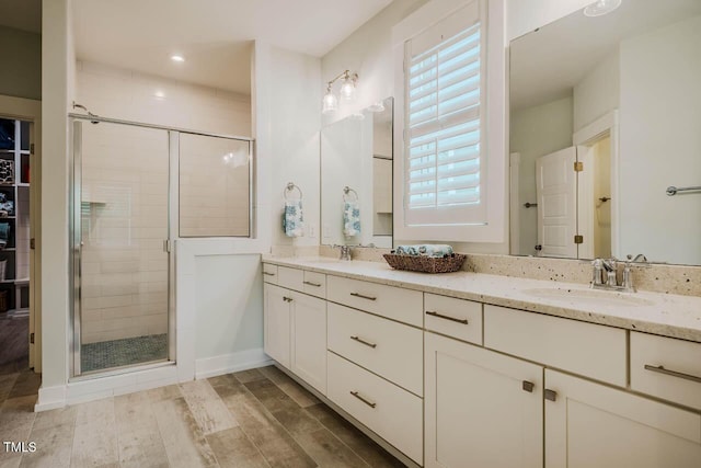328 Boone St, Chapel Hill, NC 27516 - full bath featuring a shower stall, double vanity, wood finished floors, recessed lighting, and baseboards