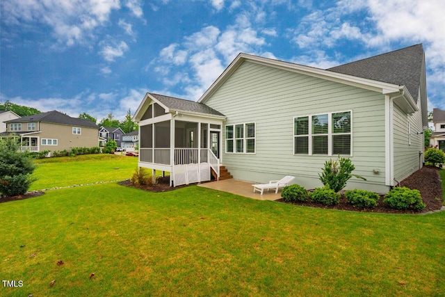 328 Boone St, Chapel Hill, NC 27516 - rear view of house with a sunroom, a patio, and a yard