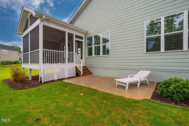 328 Boone St, Chapel Hill, NC 27516 - back of property with a patio area, a yard, and a sunroom
