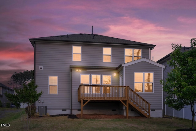 back of property featuring fence, a deck, crawl space, stairway, and central AC unit
